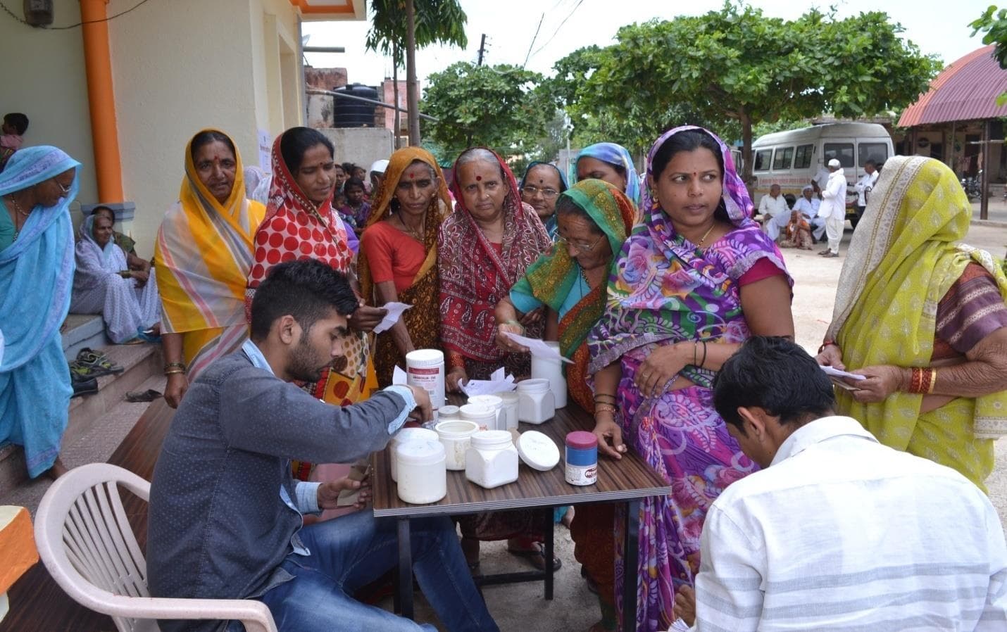 Women receiving care at a community health camp