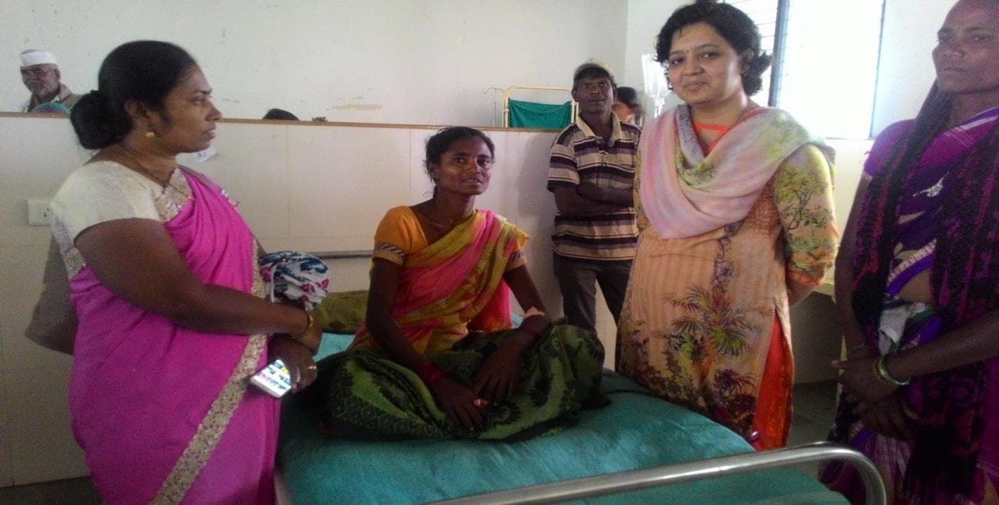 Women receiving care during health outreach