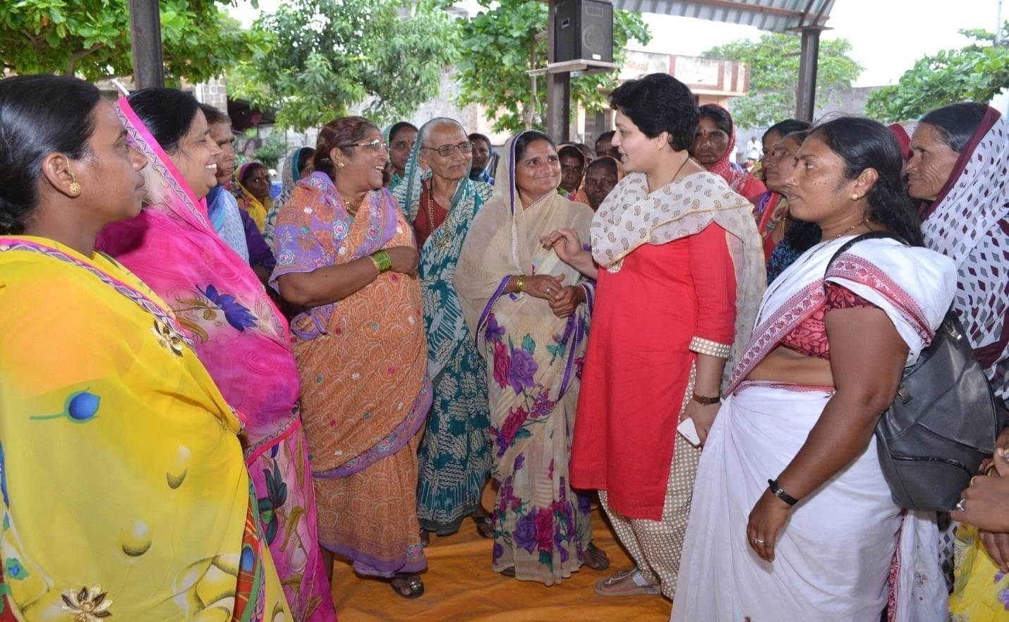 Women speaking together during a Self Help Group gathering